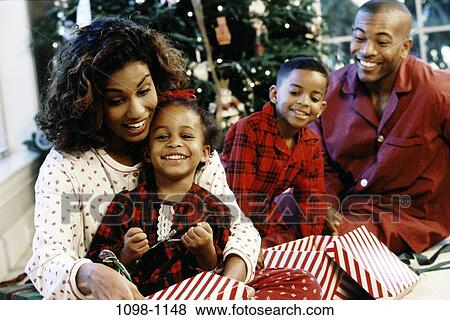 people, smiling, Christmas, looking, watching, smile View Large Photo Image Stock Photo - people, smiling, Christmas, looking, watching, smile. Fotosearch