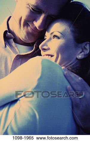 people, smiling, couple, blue, outdoors, romantic, Middle-aged View Large Photo Image Stock Photography - people, smiling, couple, blue, outdoors, romantic, Middle-aged. Fotosearch