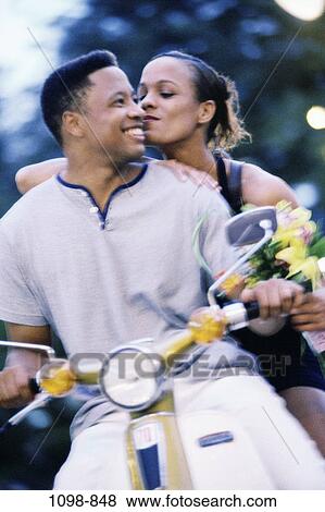 people, smiling, couple, motorcycle, flowers, outdoors, transportation View Large Photo Image Stock Photo - people, smiling, couple, motorcycle, flowers, outdoors, transportation. Fotosearch