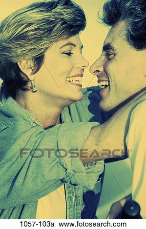 people, smiling, couple, outdoors, Middle-aged, denim, embraced View Large Photo Image Stock Image - people, smiling, couple, outdoors, Middle-aged, denim, embraced. Fotosearch