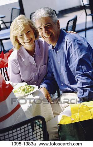 people, smiling, couple, outdoors, Middle-aged, joyous, dining out View Large Photo Image Stock Image - people, smiling, couple, outdoors, Middle-aged, joyous, dining out. Fotosearch