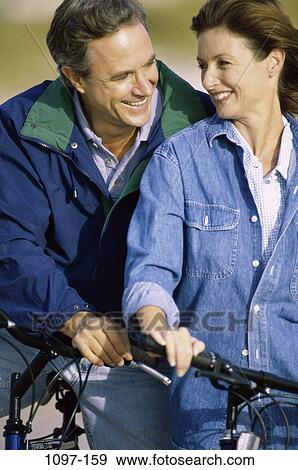 people, smiling, couple, outdoors, Middle-aged, family, fun View Large Photo Image Stock Photo - people, smiling, couple, outdoors, Middle-aged, family, fun. Fotosearch