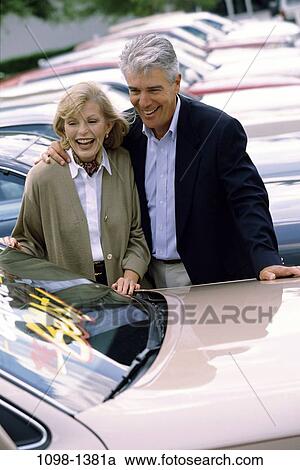 people, smiling, couple, senior, outdoors, cars, shopping View Large Photo Image Stock Image - people, smiling, couple, senior, outdoors, cars, shopping. Fotosearch