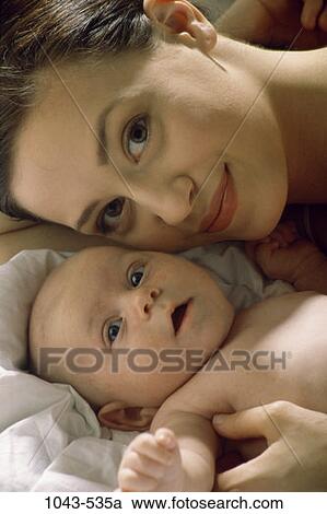 people, smiling, mother, baby, awe, family, affection View Large Photo Image Stock Image - people, smiling, mother, baby, awe, family, affection. Fotosearch