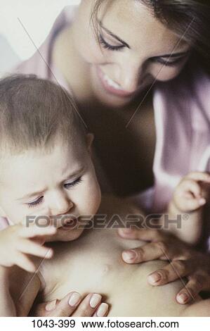 people, smiling, mother, baby, holding, smile, family View Large Photo Image Stock Photo - people, smiling, mother, baby, holding, smile, family. Fotosearch