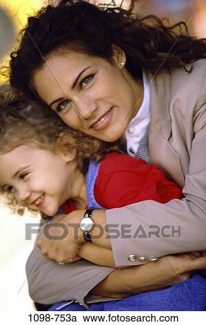 people, smiling, mother, happy, outdoors, hugging, jacket View Large Photo Image Stock Image - people, smiling, mother, happy, outdoors, hugging, jacket. Fotosearch