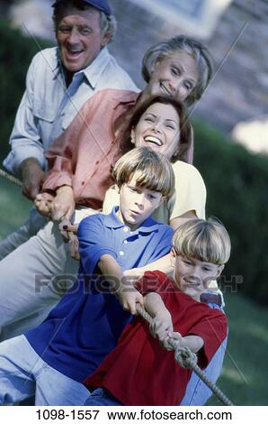 Stock Photo - people, smiling, mother, outdoors, pulling, smile, family. Fotosearch
