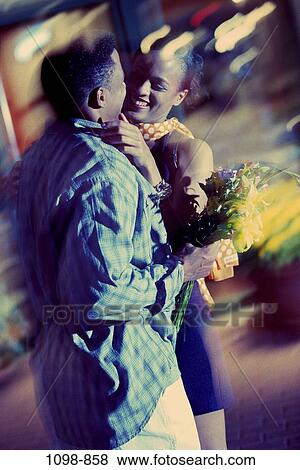 people, smiling, night, couple, happy, flowers, young View Large Photo Image Stock Photo - people, smiling, night, couple, happy, flowers, young. Fotosearch