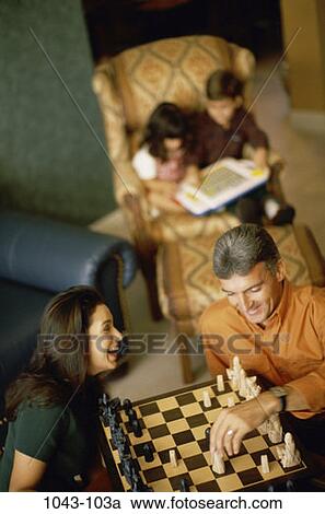 people, smiling, playing, chess, sitting, mother, Hispanic View Large Photo Image Stock Image - people, smiling, playing, chess, sitting, mother, Hispanic. Fotosearch