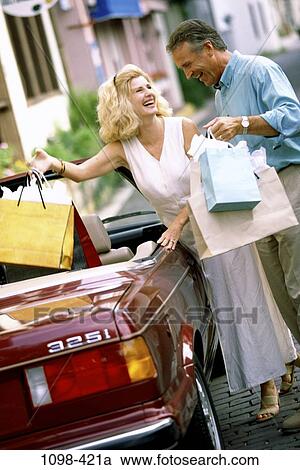 people, smiling, shirt, car, watch, convertible, laughing View Large Photo Image Stock Image - people, smiling, shirt, car, watch, convertible, laughing. Fotosearch