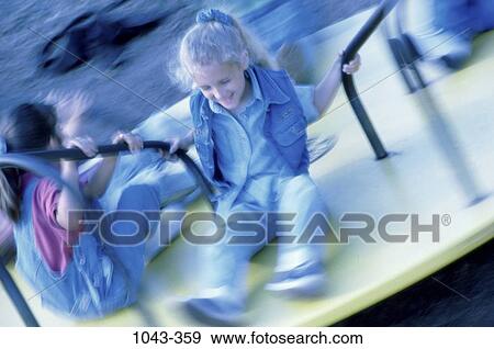 people, smiling, sitting, laughing, playful, playground, outdoors View Large Photo Image Stock Photo - people, smiling, sitting, laughing, playful, playground, outdoors. Fotosearch