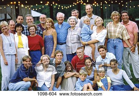 Picture - people, smiling, standing, extended, family, gathering. Fotosearch