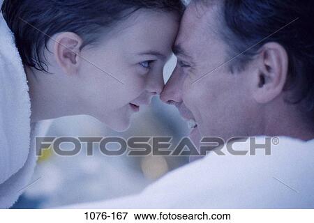 people, smiling, staring, playful, ear, contemplation, family View Large Photo Image Stock Photo - people, smiling, staring, playful, ear, contemplation, family. Fotosearch