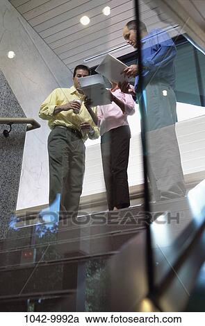 people, stairs, paperwork, reading, business, casual, indoors View Large Photo Image Stock Image - people, stairs, paperwork, reading, business, casual, indoors. Fotosearch