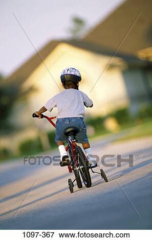 people, suburban, bicycle, helmet, boy, street, outdoors View Large Photo Image Stock Photo - people, suburban, bicycle, helmet, boy, street, outdoors. Fotosearch