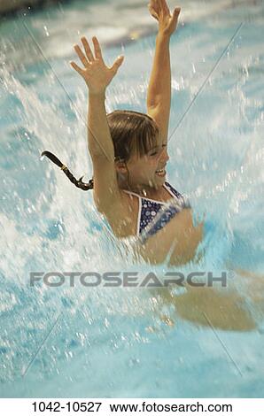 Stock Photo - people, swim, water, pool, swimming, splash, girl. Fotosearch
