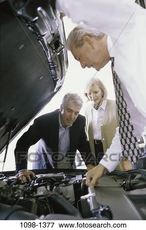 people, talking, couple, car, curious, Middle-aged, looking View Large Photo Image Stock Photo - people, talking, couple, car, curious, Middle-aged, looking. Fotosearch