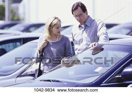 people, talking, couple, car, outdoors, cars View Large Photo Image Picture - people, talking, couple, car, outdoors, cars. Fotosearch