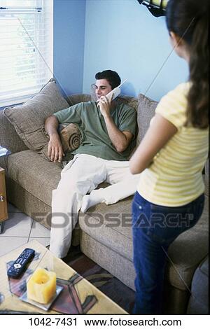 people, telephone, talking, couple, sitting, phone, couch View Large Photo Image Stock Image - people, telephone, talking, couple, sitting, phone, couch. Fotosearch