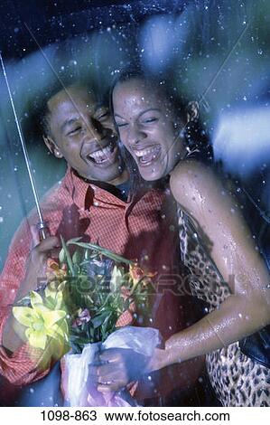 people, umbrella, couple, rain, excited, laughing, flowers View Large Photo Image Stock Image - people, umbrella, couple, rain, excited, laughing, flowers. Fotosearch