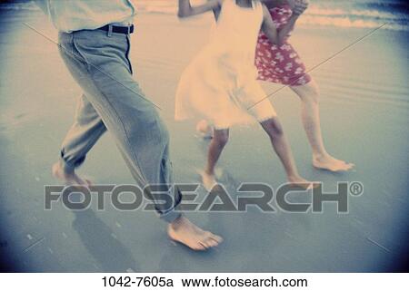 people, walking, blue, beach, legs, family, daughter View Large Photo Image Stock Image - people, walking, blue, beach, legs, family, daughter. Fotosearch