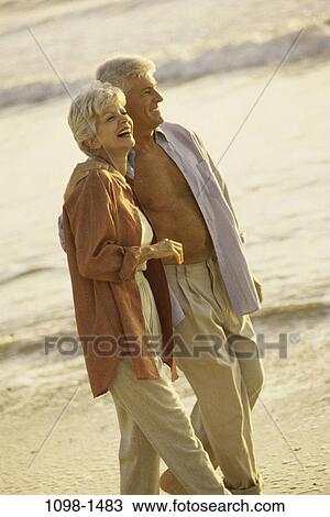 people, walking, couple, senior, beach, laughing, waves View Large Photo Image Stock Image - people, walking, couple, senior, beach, laughing, waves. Fotosearch