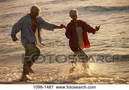 people, water, couple, senior, happy, beach, splash View Large Photo Image Stock Photo - people, water, couple, senior, happy, beach, splash. Fotosearch