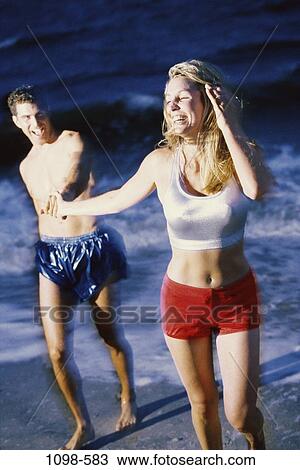 people, water, night, walking, couple, ocean, happy View Large Photo Image Stock Image - people, water, night, walking, couple, ocean, happy. Fotosearch