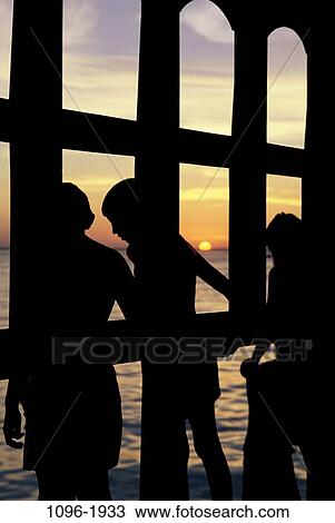people, water, playing, dusk, evening, sunset, beach View Large Photo Image Stock Image - people, water, playing, dusk, evening, sunset, beach. Fotosearch