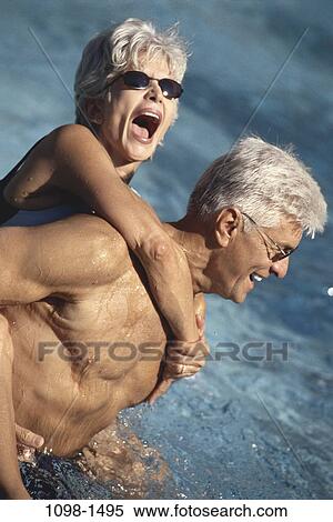 people, water, pool, couple, senior, laughing, sunglasses View Large Photo Image Stock Photography - people, water, pool, couple, senior, laughing, sunglasses. Fotosearch