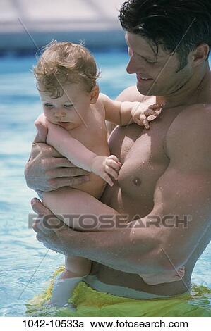 Stock Image - people, water, pool, smiling, baby, holding. Fotosearch