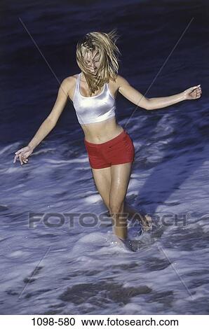 people, water, woman, night, ocean, beach, splash View Large Photo Image Stock Image - people, water, woman, night, ocean, beach, splash. Fotosearch
