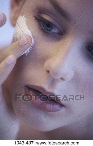 people, woman, face, concentration, concentrating, beauty, lotion View Large Photo Image Stock Photo - people, woman, face, concentration, concentrating, beauty, lotion. Fotosearch