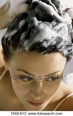 Stock Image - people, woman, Hispanic, hair, bath, brunette, suds. Fotosearch