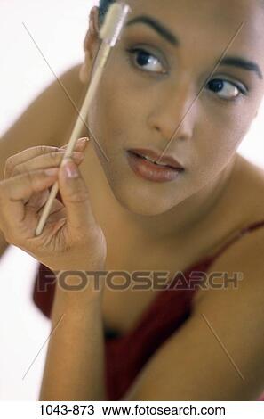 people, woman, Hispanic, makeup, brunette, cosmetics, indoors View Large Photo Image Stock Image - people, woman, Hispanic, makeup, brunette, cosmetics, indoors. Fotosearch