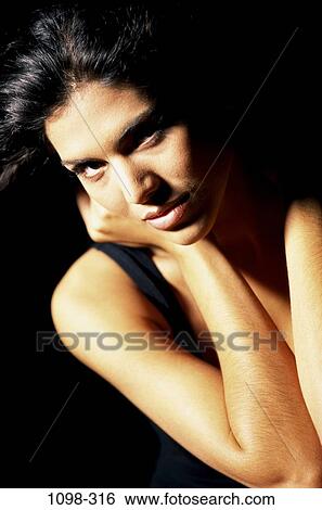 people, woman, Hispanic, serious, indoors, Caucasian, sultry View Large Photo Image Stock Photograph - people, woman, Hispanic, serious, indoors, Caucasian, sultry. Fotosearch