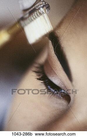 Stock Image - people, woman, makeup, cosmetic, young adult, Young women cosmetics. Fotosearch