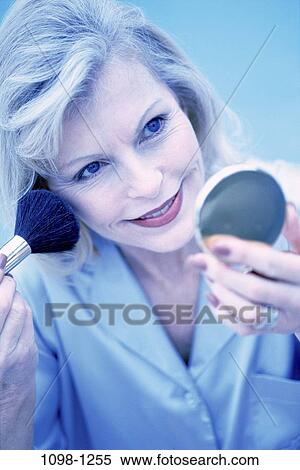 people, woman, mirror, makeup, Middle-aged, blond, blush View Large Photo Image Stock Photography - people, woman, mirror, makeup, Middle-aged, blond, blush. Fotosearch