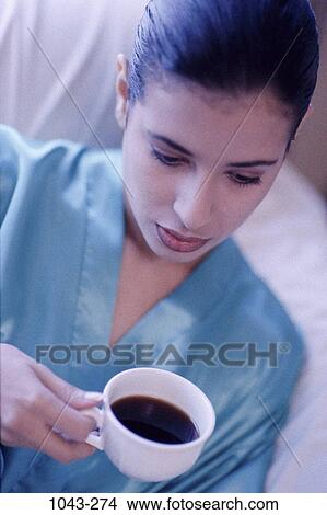 people, woman, morning, coffee, concentration, Hispanic, bed View Large Photo Image Picture - people, woman, morning, coffee, concentration, Hispanic, bed. Fotosearch