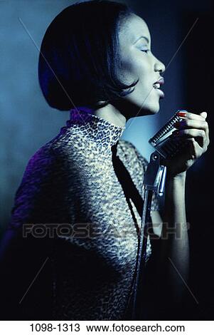 people, woman, profile, entertainment, singing, brunette View Large Photo Image Stock Image - people, woman, profile, entertainment, singing, brunette. Fotosearch