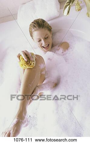 people, woman, smiling, bubbles, laughing, laid back, cleaning View Large Photo Image Stock Image - people, woman, smiling, bubbles, laughing, laid back, cleaning. Fotosearch