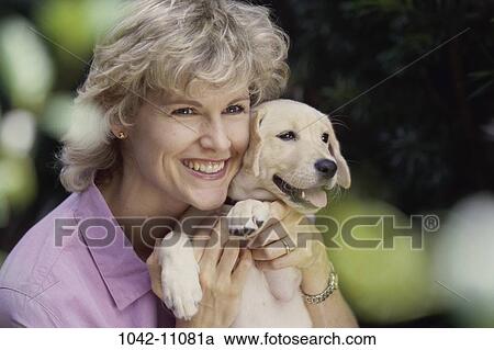 people, woman, smiling, dog, puppy, pet, holding View Large Photo Image Stock Image - people, woman, smiling, dog, puppy, pet, holding. Fotosearch