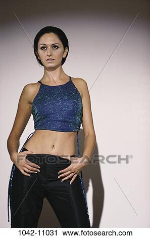 people, woman, top, standing, stand, posing, brunette View Large Photo Image Stock Image - people, woman, top, standing, stand, posing, brunette. Fotosearch