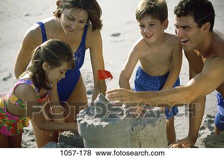 sand, people, Hispanic, beach, sand castle, challenges, teamwork View Large Photo Image Stock Photo - sand, people, Hispanic, beach, sand castle, challenges, teamwork. Fotosearch