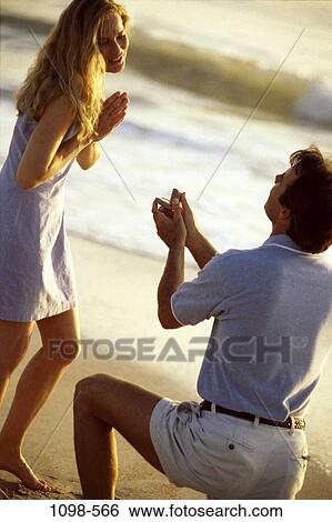 sand, people, water, couple, ocean, excitement, happy View Large Photo Image Stock Photograph - sand, people, water, couple, ocean, excitement, happy. Fotosearch