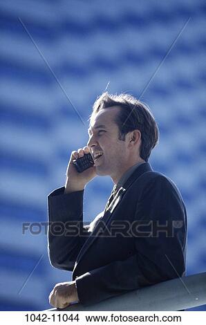 telephone, railing, talking, phone, business, outdoors View Large Photo Image Picture - telephone, railing, talking, phone, business, outdoors. Fotosearch