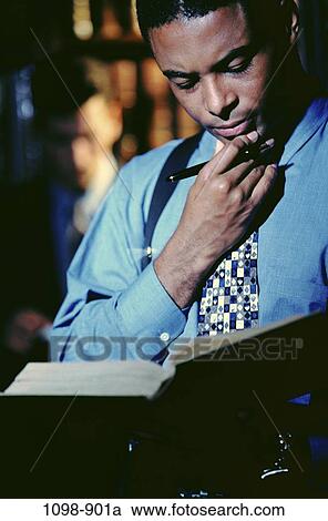 Stock Image - tie, pen, wisdom, shirt, reading, book. Fotosearch
