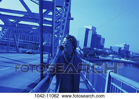 water, woman, telephone, urban, walking, talking, blue View Large Photo Image Stock Image - water, woman, telephone, urban, walking, talking, blue. Fotosearch