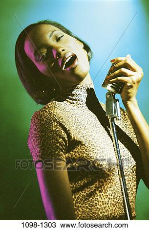 woman, music, arts, entertainment, lights, singing View Large Photo Image Stock Image - woman, music, arts, entertainment, lights, singing. Fotosearch