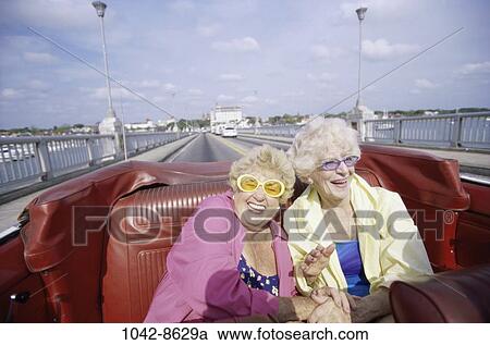 women, people, senior, convertible, laughing, sunglasses View Large Photo Image Stock Image - women, people, senior, convertible, laughing, sunglasses. Fotosearch